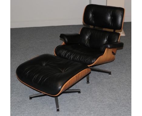 After Charles and Ray Eames: A Cherry 670 Lounge Chair and 671 Ottoman, modern, with black leather padded upholstered covers,