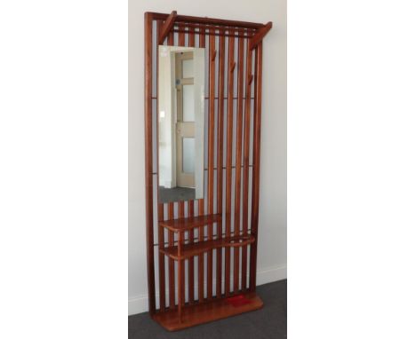 A 1960's Danish Teak Hall Stand, with slatted back, mounted with a rectangular mirror, with racks and coat hooks above two sh