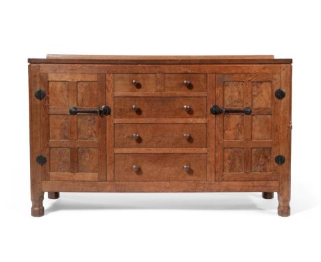 Mouseman: A 1930's Robert Thompson of Kilburn Panelled English Oak 4ft 9'' Sideboard, with raised upstand, above two cupboard