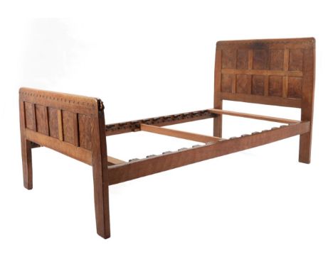 Mouseman: A 1930's Robert Thompson of Kilburn English Burr Oak 3ft Bedstead, the headboard dated 1934, the footboard with car