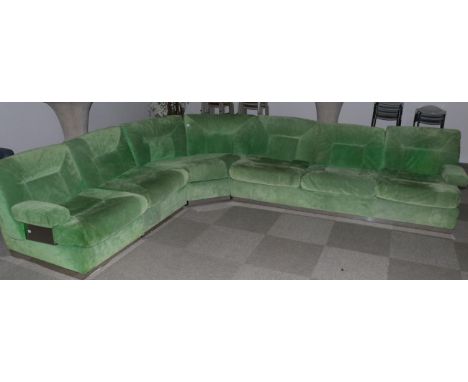 Roche-Bobois: A 1970's Corner Lounge Suite, upholstered in lime green suede, in five sections, comprising a three-seater sofa