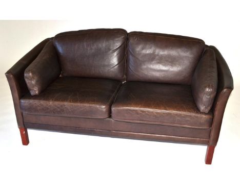 A Danish Leather Two-Seater Sofa, with arched back and curved arms, on stained mahogany square form legs, 155cm by 80cm by 61