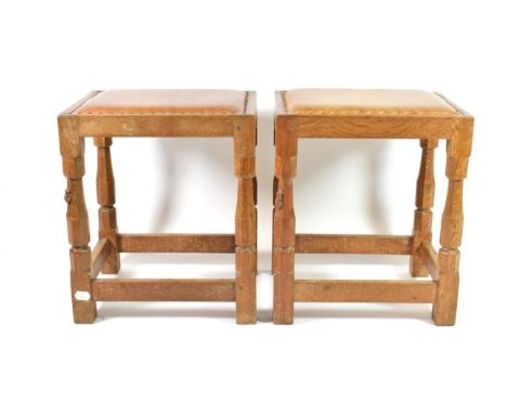 Mouseman: A Robert Thompson of Kilburn English Oak Dressing Table Stool, with upholstered cow hide seat, on four octagonal le