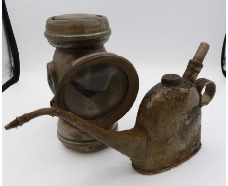 An old brass oil can and a Gameges Nulite bicycle lamp 