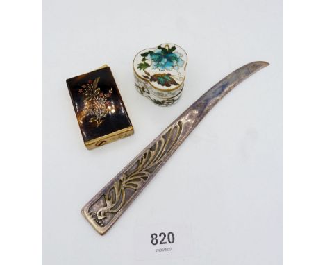 An enamel floral box, silver plated paper knife and a Consul Amor perfume atomiser in the form of a cigarette lighter 