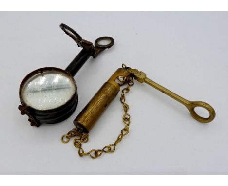 A metal compass with folding lenses and sights and a brass folding pocket sight 