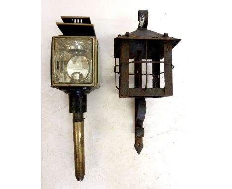 A cast iron wall lantern and a carriage lamp 