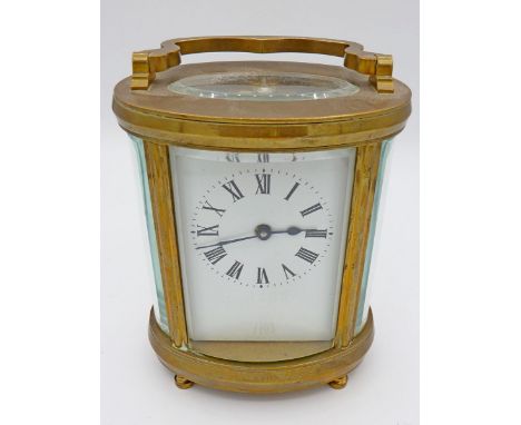 An Edwardian brass oval carriage clock, 11.5cm to top of case 
