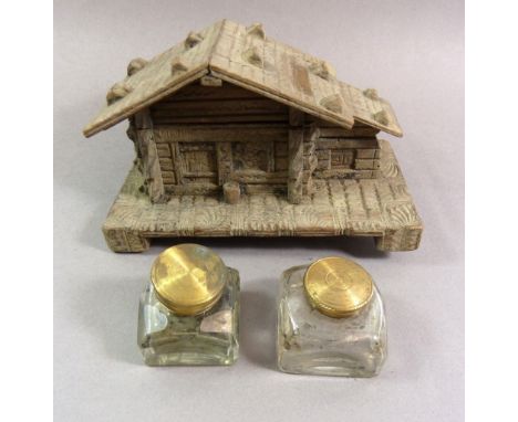Two 19th century cut glass inkwells and a novelty chalet wooden inkwell 