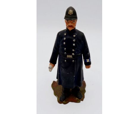 A painted metal cast model policeman novelty inkwell - the lid jammed, 12cm tall 