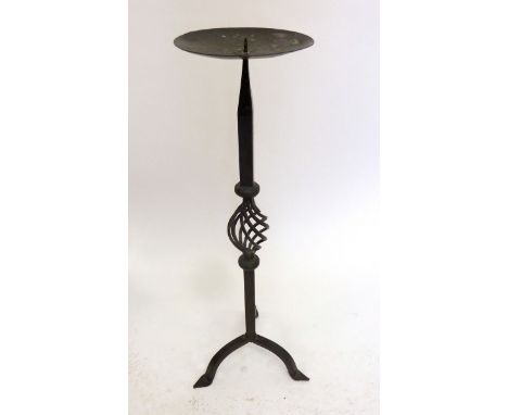 A wrought iron floor standing candlestick on triple base, 66 cm high 