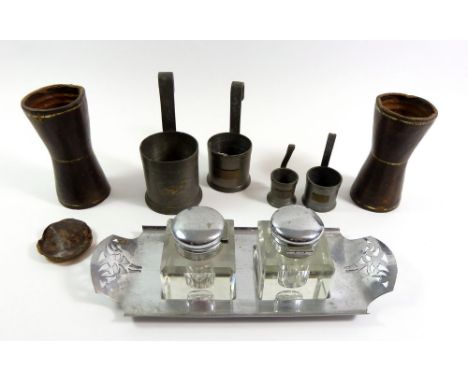 Two antique leather dice shakers, a set of pewter measures and a Community plate inkwell