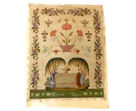 A 19th century tapestry sampler or picture with floral border, flowers and angels with two women standing by a tomb - unframe