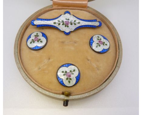 A silver and enamel floral brooch and three matching buttons boxed, Birmingham 1913 by J Aitkin &amp; Son 