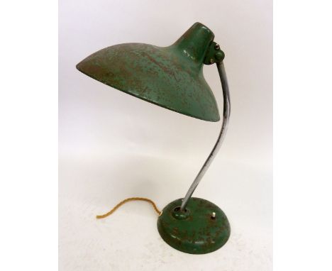 A vintage metal desk lamp and shade