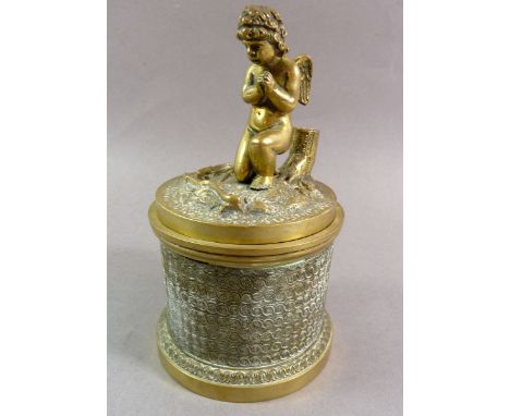 A 19th century brass inkwell with cherub to lid, 14cm