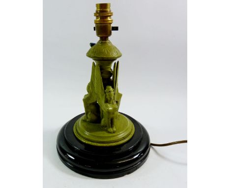 A green painted Art Deco Egyptian style table lamp with triple sphinx decoration to stem 