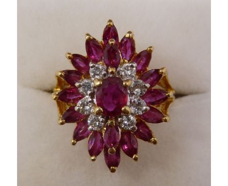 An 18 carat gold three tier ruby and diamond cluster ring, size K-L, 5.6g 