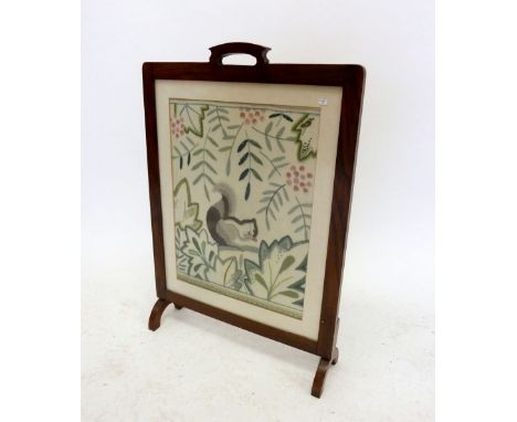 An oak framed firescreen with embroidered squirrel 