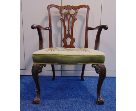 A Chippendale style mahogany armchair with upholstered seat and leaf carved scroll legs, A/F