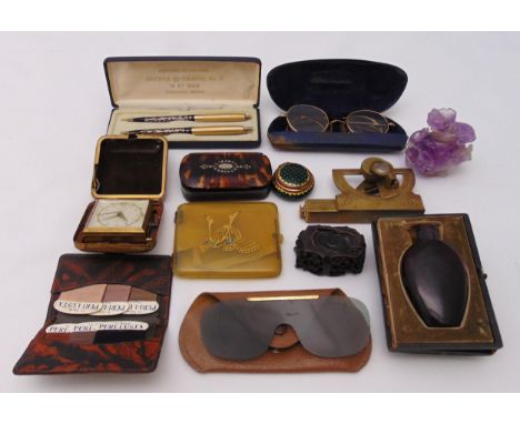 A quantity of collectables to include a cased antique ruby glass perfume bottle, vintage reading glasses, Chanel perfumed bal