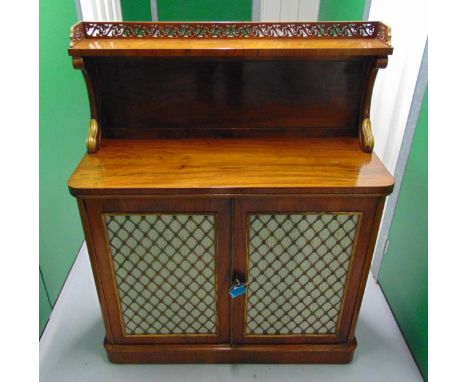 A 19th century rectangular mahogany chiffonier with an upper tier shelf above two cupboard doors with decorative brass mesh a