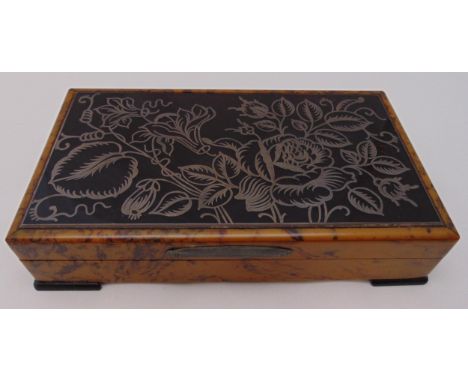 An Italian Art Deco rectangular wooden cigarette case, the hinged cover with inset white metal flowers and leaves, 4.5 x 21.5