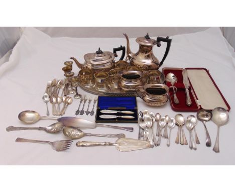 A quantity of silver plate to include a teaset, an oval tray, tea glass holders and flatware
