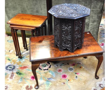 A mahogany standard lamp, a carved octagonal top occasional table, a nest of three occasional tables and a walnut coffee tabl