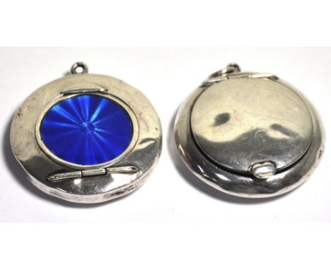 A hallmarked silver and blue enamel compact, Birmingham date mark rubbed and a George V hallmarked silver compact, Birmingham