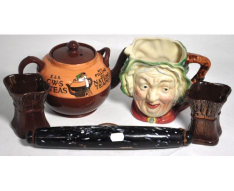 A Nailsea type rolling pin, a Beswick Sairey Gamp character jug, a large advertising tea pot for E & S. C. W. S Tea and a pai