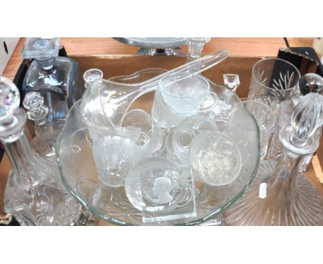 A quantity of glassware to include a punch bowl and glasses, a ships decanter and a further four decanters, drinking glasses 