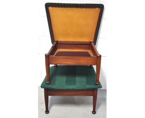 A pair of 1970s footstools each with hinged padded top with adjustable hinged bracket and raised on turned tapering legs (2).