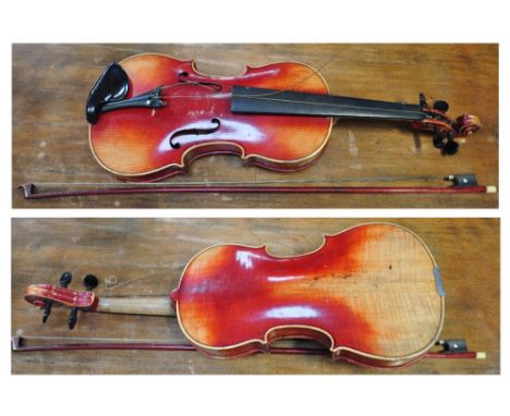 A child's cased violin with bow.