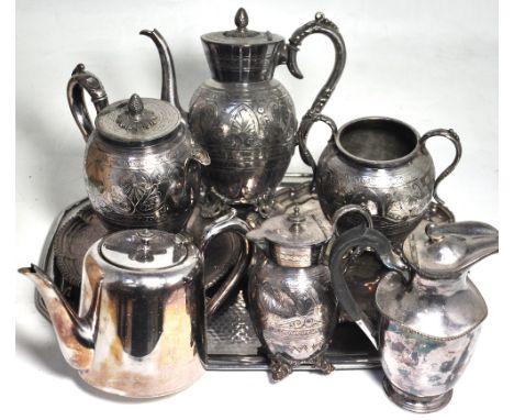 A quantity of plated ware to include an Arts and Crafts style tray, tea service and coffee pot.