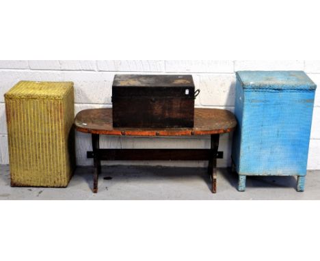 Two Lloyd Loom style linen baskets, an Arts and Crafts style copper top table and a wooden chest containing a small quantity 