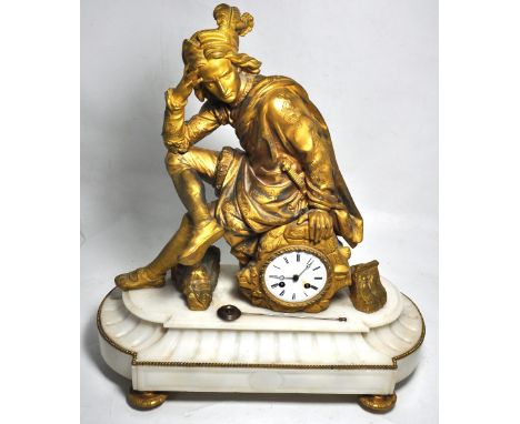 A large spelter and marble mantel clock, the central dial set below a gilt figure of a resting swordsman (af), height 57cm.
