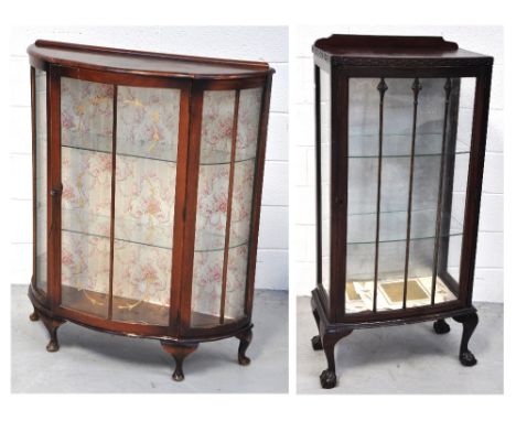 A 20th century wooden display cabinet with glazed front and two interior shelves, terminating in claw and ball feet and a fur