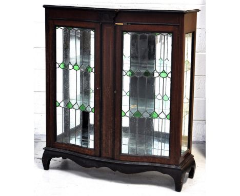 An Edwardian bow front mahogany inlaid display cabinet with two Art Nouveau glazed doors and interior glass shelves, 118 x 10