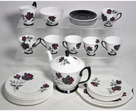 A Royal Albert "Masquerade" part tea service and a small boxed Royal Worcester bird.