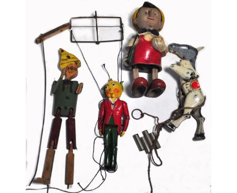 A Pinocchio composition figure with clockwork mechanism, height 20.5cm, a cold painted metal string puppet, a Luntoy Product,