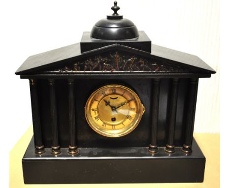 A late 19th century French black slate mausoleum mantel clock with circular dial set with Roman numerals flanked by fluted pi