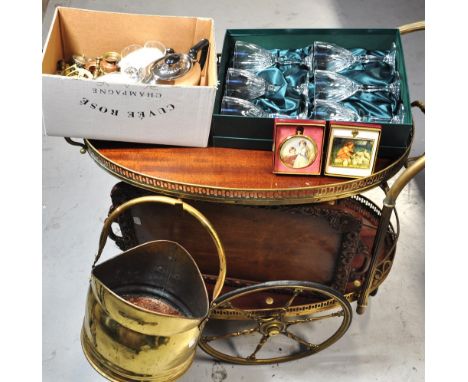 A circa 1960s tea trolley, a carved tray, a brass coal bucket containing a small quantity of brassware, a boxed set of crysta