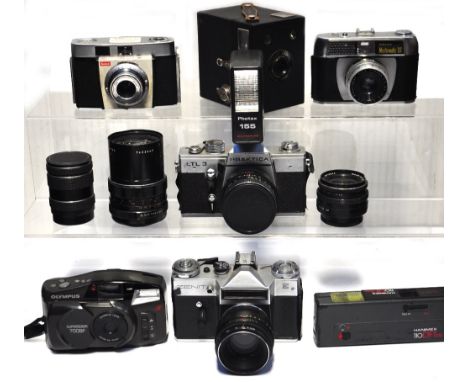 A quantity of 35mm cameras to include a Praktica LTL3 with standard lens and flash gun, a Pentacon f2.8 135mm, a Pentacon f3.