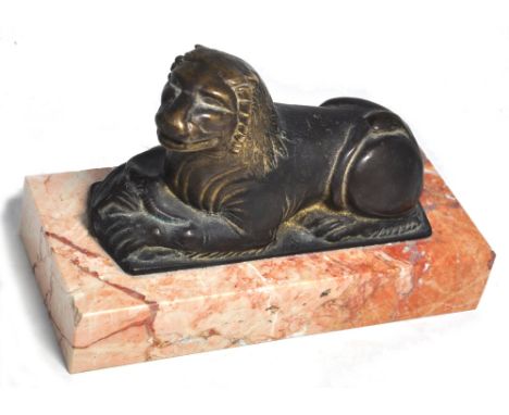 A French Art Deco bronze figure of a lion raised on a later rectangular marble plinth, length 28cm.