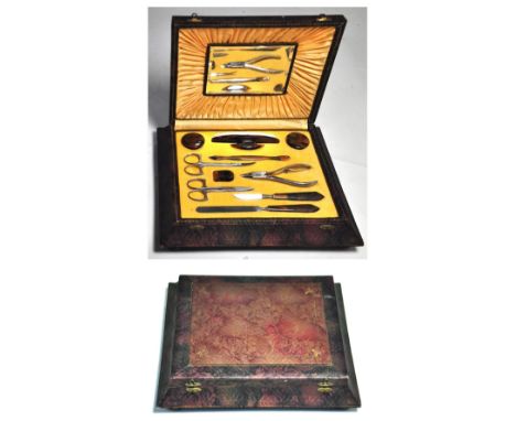 A vintage cased manicure set with faux tortoiseshell handles.