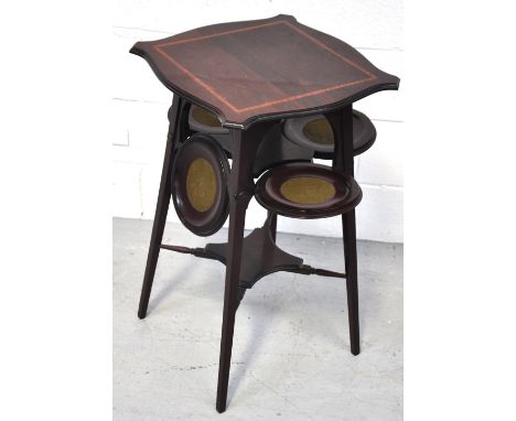 An Edwardian mahogany satinwood inlaid Art Nouveau design occasional table/cake stand, the serpentine outlined top above four