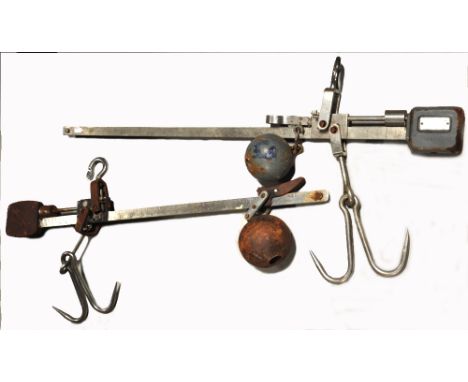 Two sets of 20th century butchers steelyard scales with rising horizontal beam and metal ball mechanism, length 102cm (2).