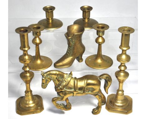 Three pairs of brass candlesticks, a brass figure of a carthorse and a brass model of a ladies boot, height of tallest candle