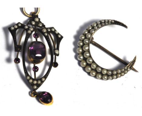 A yellow metal Art Nouveau pendant set with amethysts and pearls and a silver moon brooch set with pearls (2).